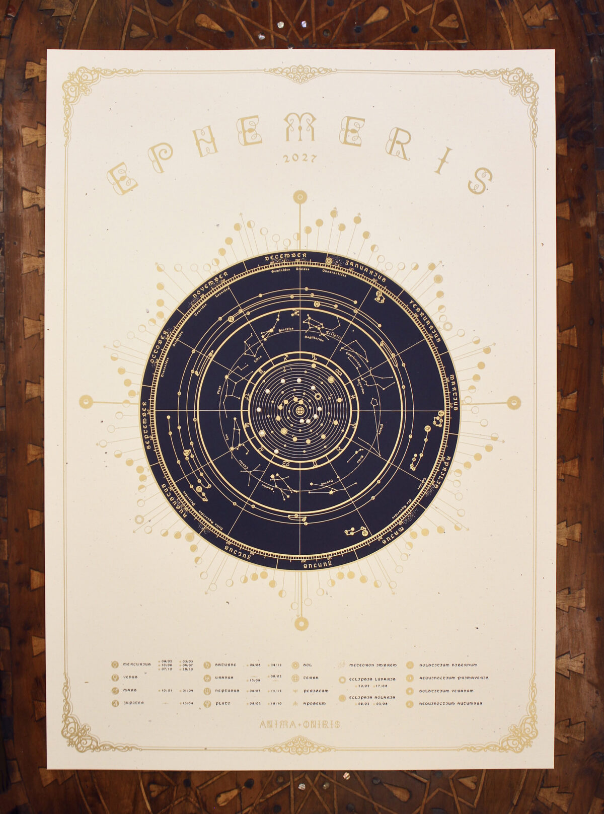 A2 Ephemeris 2027 astronomical calendar with circular celestial chart, Moon phases and gold screen-printed details.