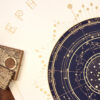 Detail of the 2027 celestial ephemeris showing zodiac constellations, planetary paths and golden lunar phases.